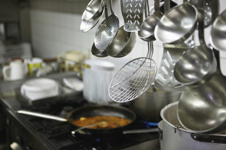 Close up of spoons in restaurant kitchen